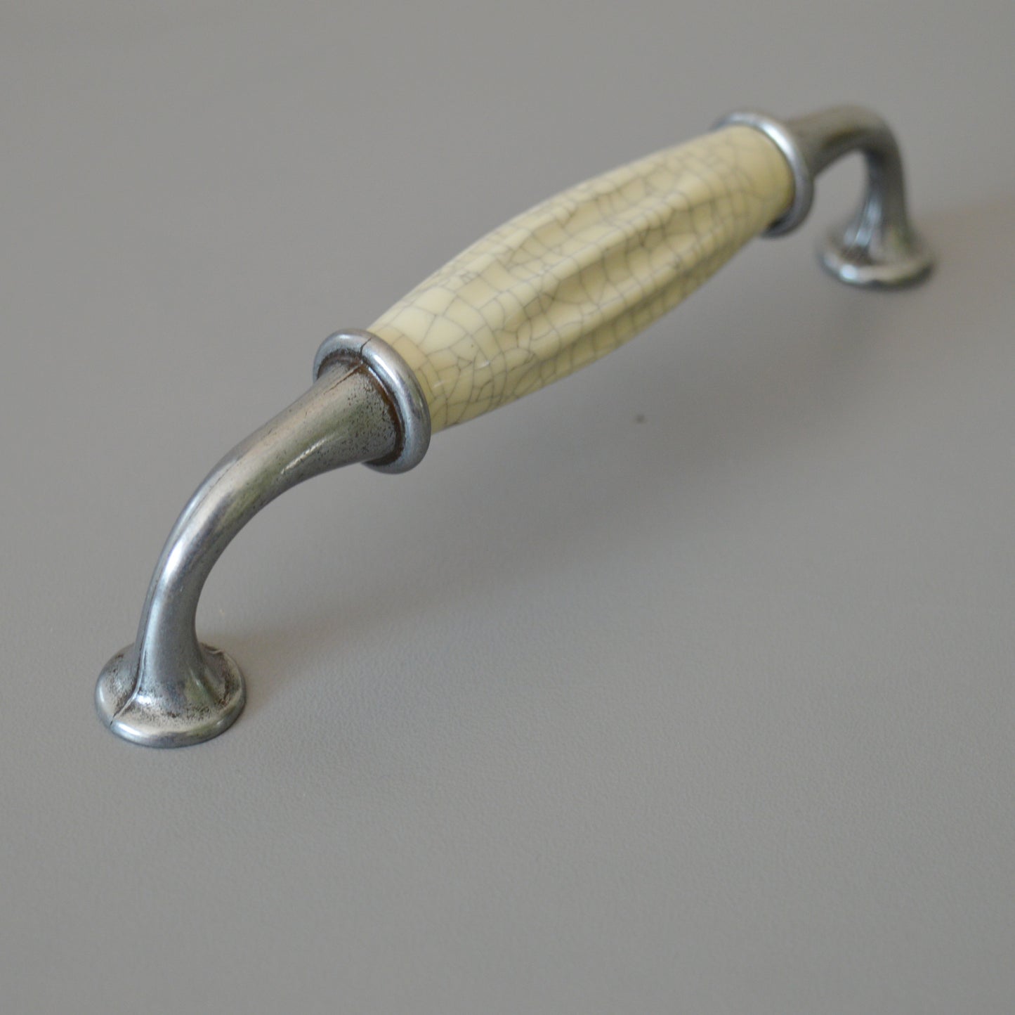 Metal-porcelain furniture handle, available in several colors