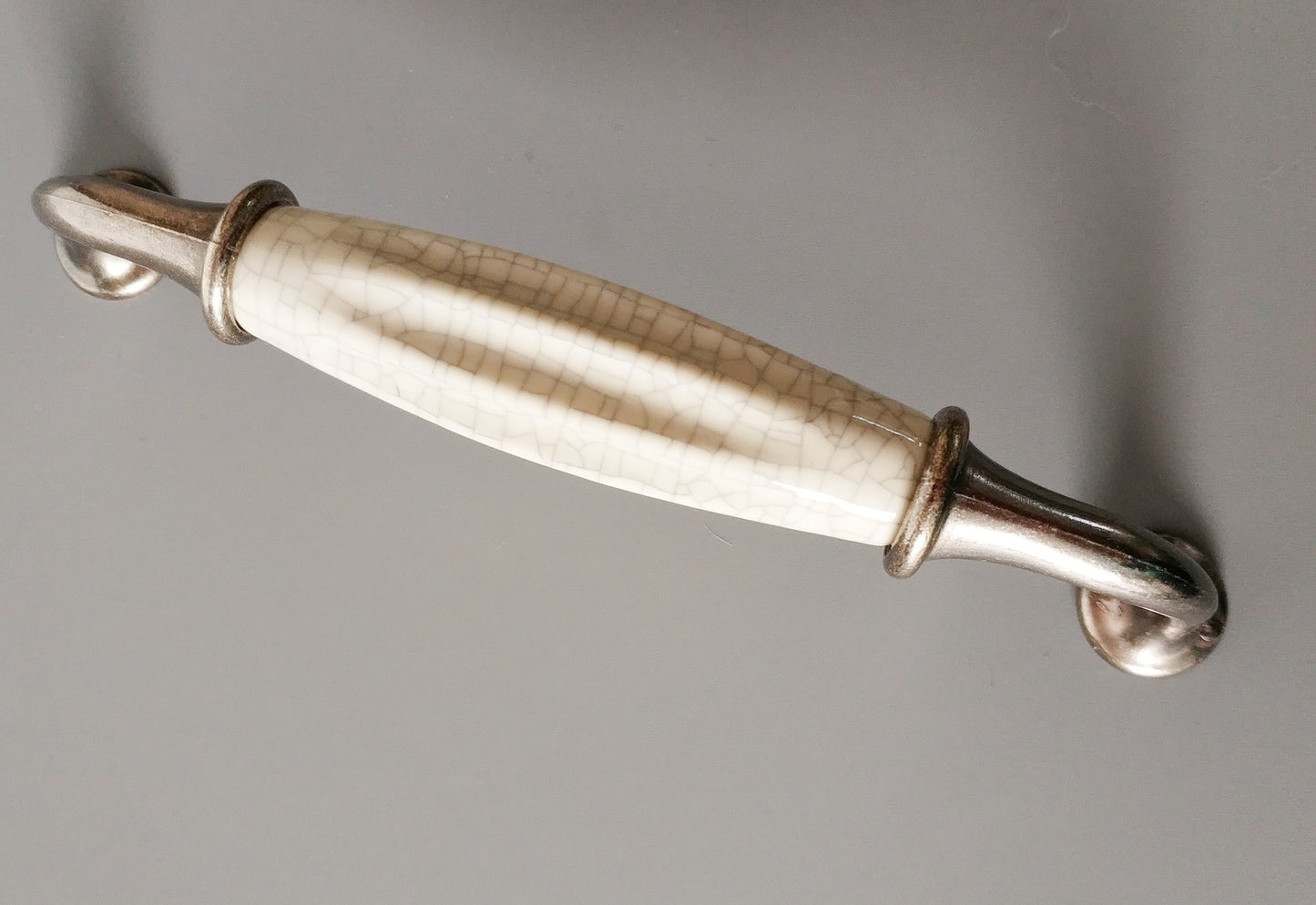 Metal-porcelain furniture handle, available in several colors