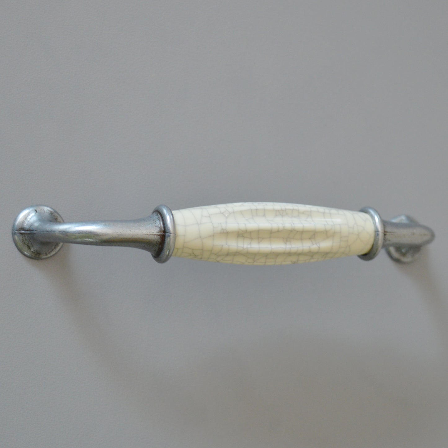 Metal-porcelain furniture handle, available in several colors