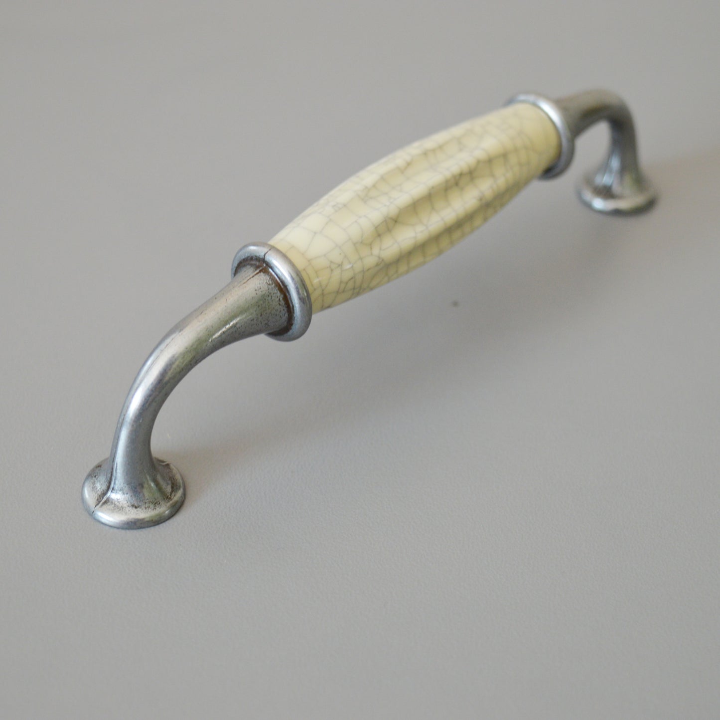 Metal-porcelain furniture handle, available in several colors