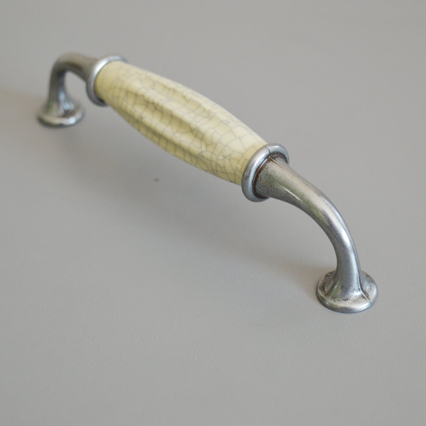 Metal-porcelain furniture handle, available in several colors